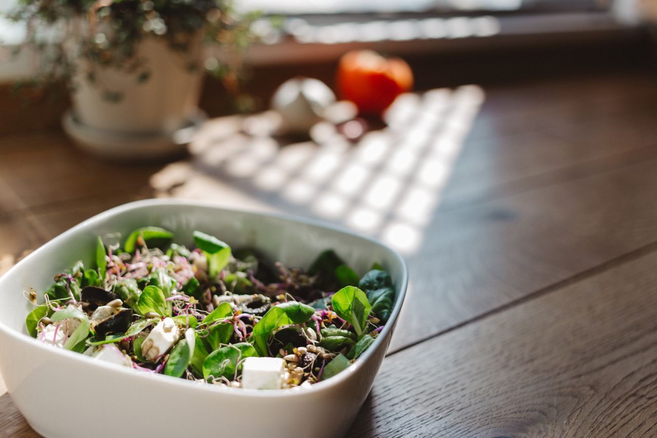 Mastering the First Impression: Your intriguing post title goes here A vibrant and healthy bowl of tofu salad with fresh greens, captured in natural light on a wooden table.